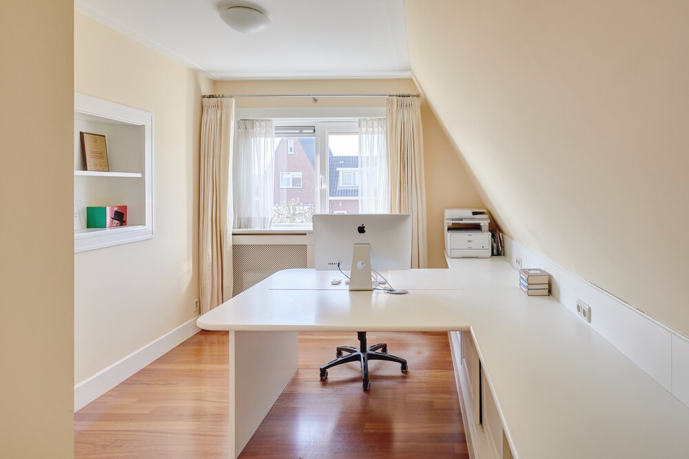 Home office with beautifully integrated built-in storage.