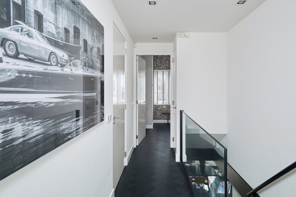 Landing with artwork on the wall that I discussed with the owner (great story — feel free to ask about it)