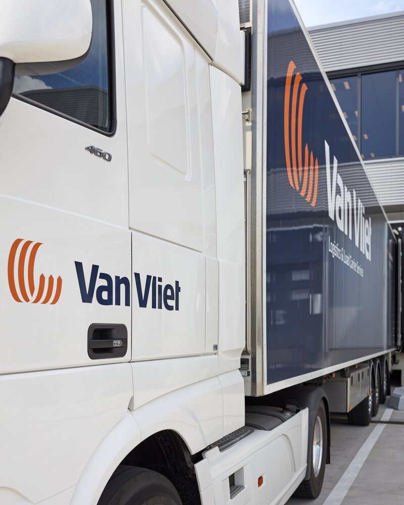 Van Vliet Logistics & Load Carrier Services truck at the loading dock.