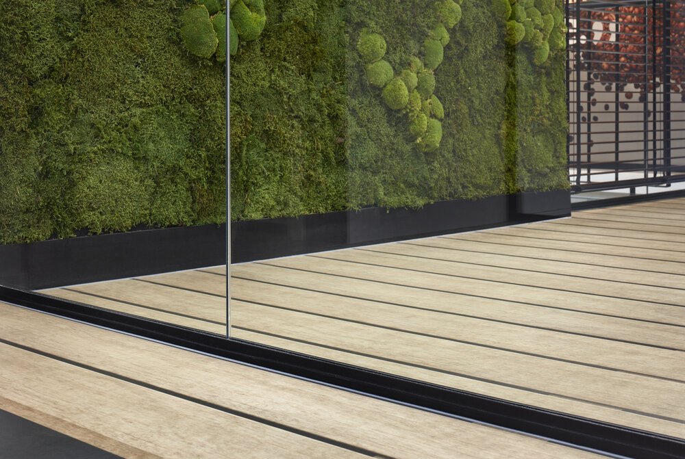 Detail photo of glass partitions in the office interior.