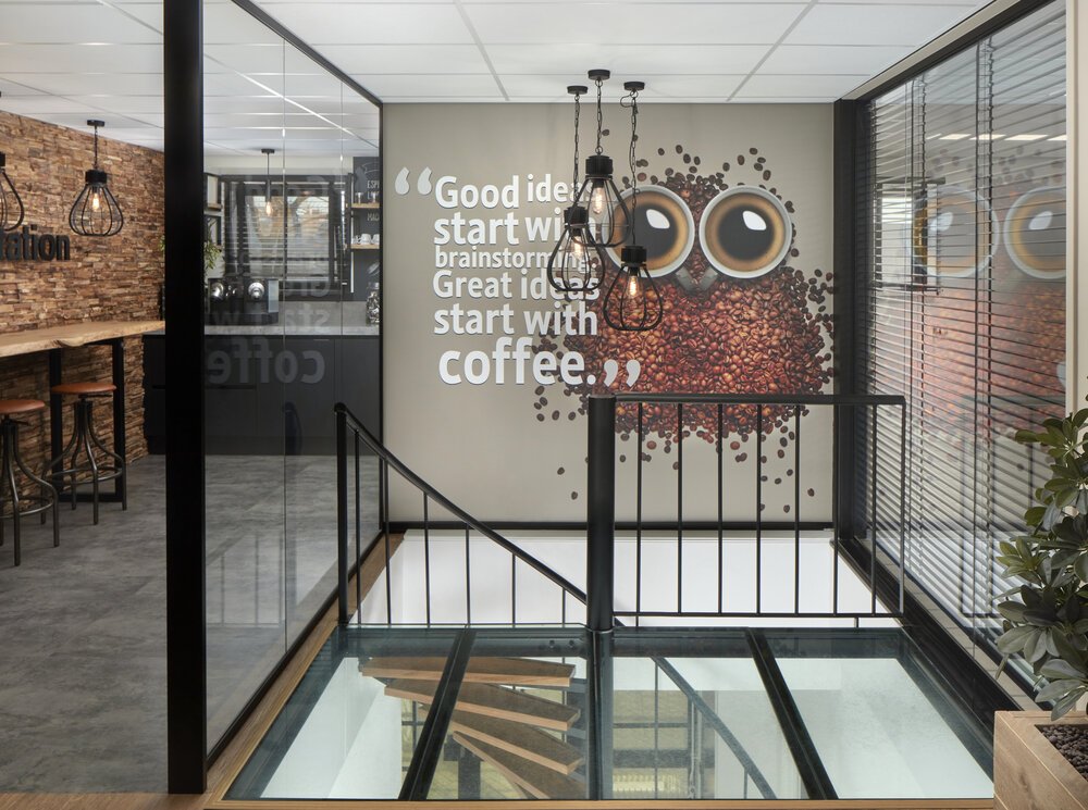 Stairwell with glass walls and a transparent floor.