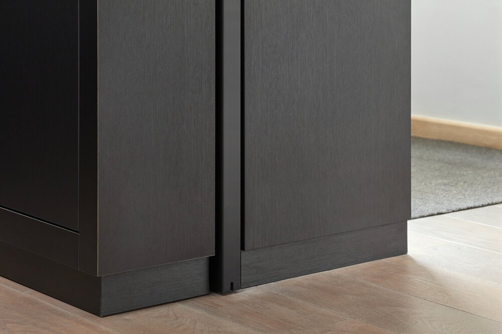 Detail photo showing where the sliding door disappears into the cabinet.