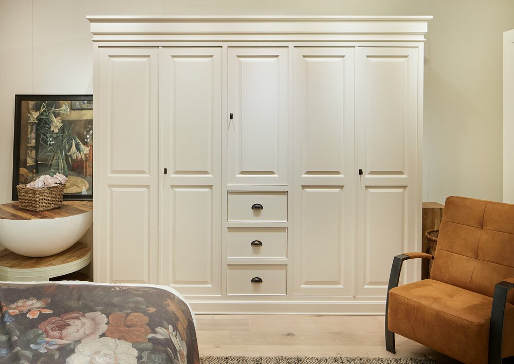 Close-up of a modern bedroom wardrobe with furnishings.