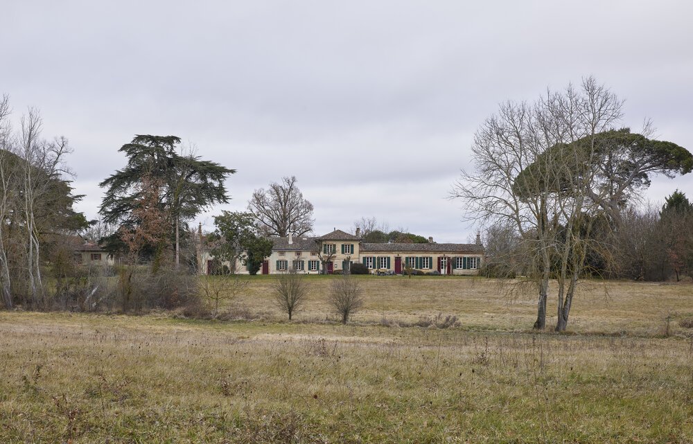 Exterior view from a slightly greater distance, still taken on the property’s own land.
