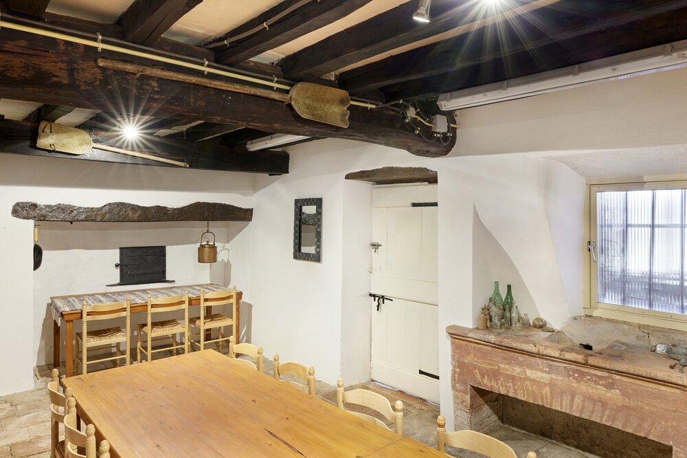 Photo of the dining hall with the original bread oven.