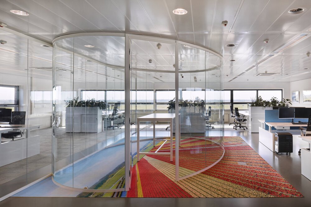 Workspaces with adjacent meeting areas.