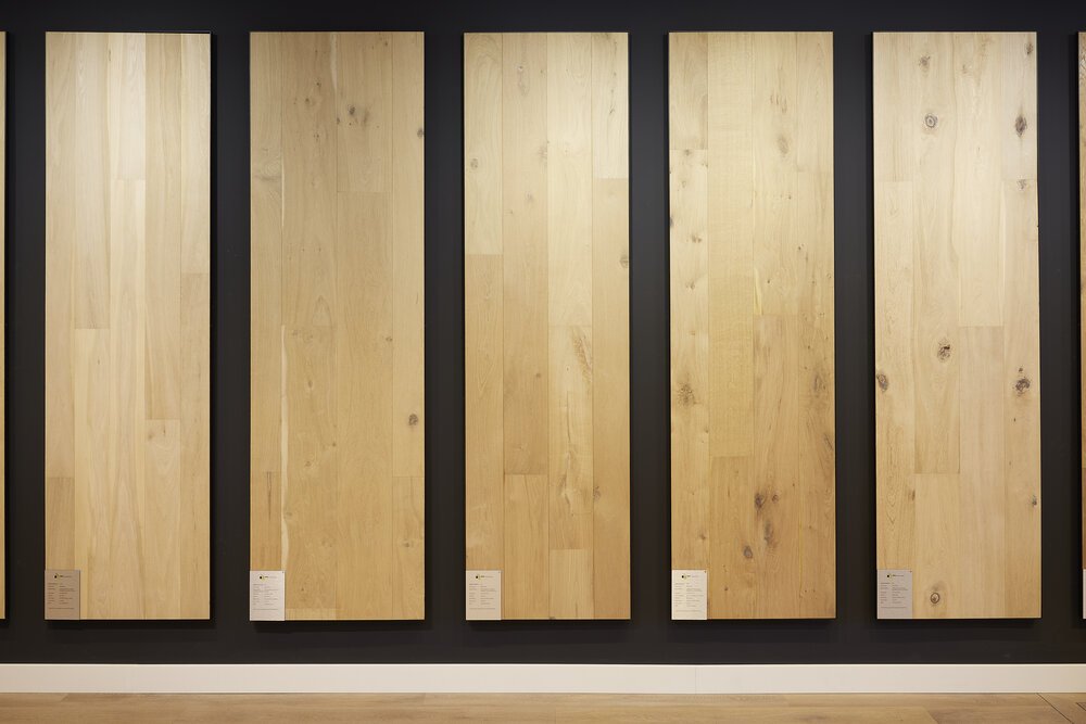 Display boards in the showroom with floor samples in various finishes.