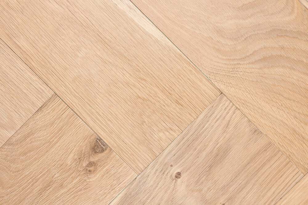 This oak herringbone plank has no bevel and is untreated.
