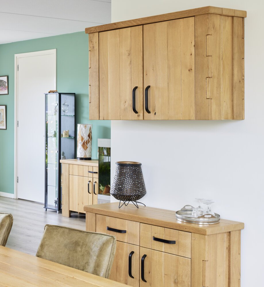 Sideboard with part of the dining table and sideboard in the background.