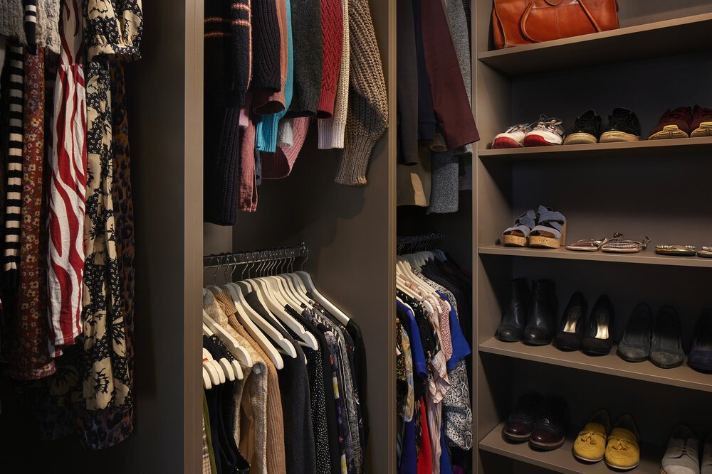 Detail shot of the various storage compartments in the bespoke wardrobe.