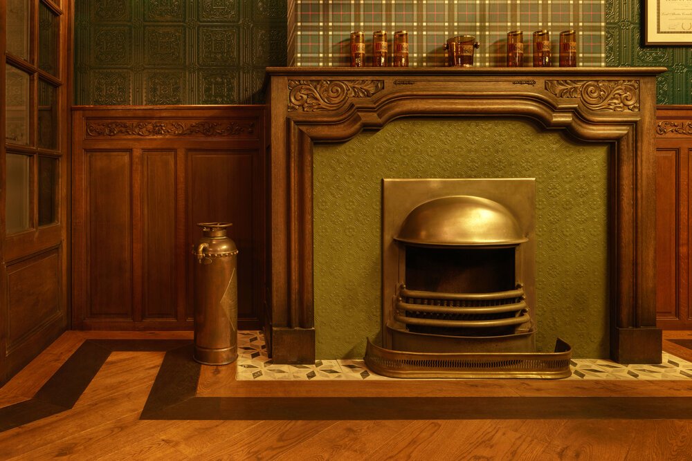 Photo of the fireplace mantel with the beautifully finished wooden floor.