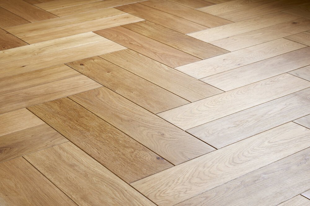 Reflections of light reveal whether the oil has been properly absorbed by the oak.