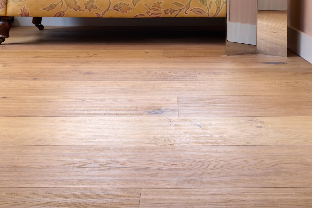 Detail shot of the hand-scraped oak plank flooring.
