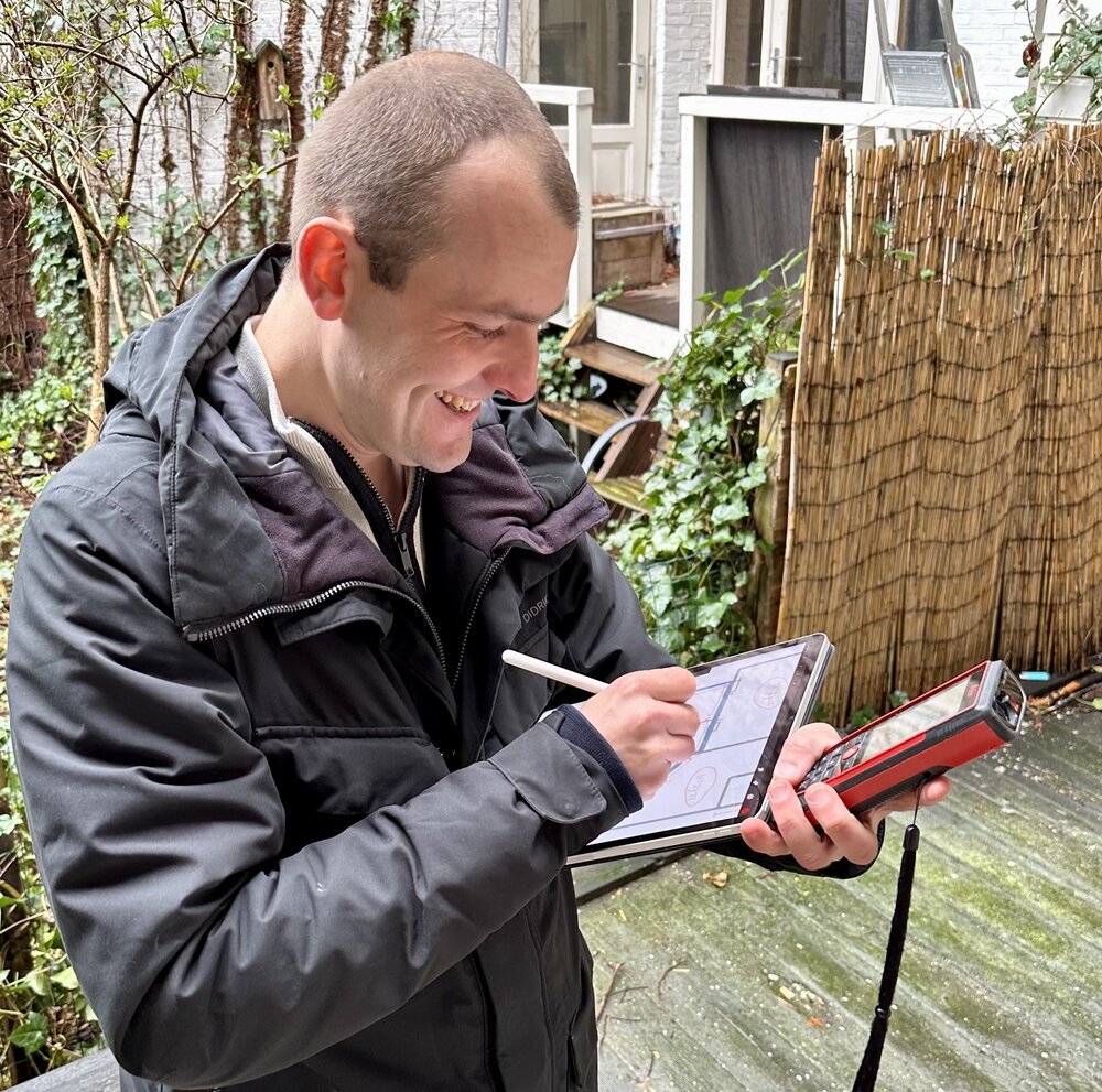 Sketching on my iPad and measuring with my Leica Disto on location.