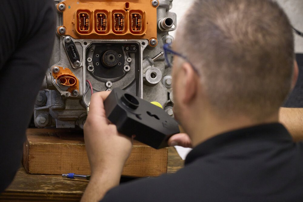 Replacing parts during technical training.