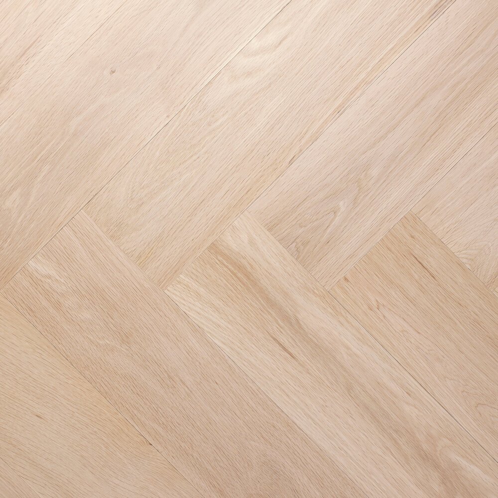 Detailfoto van een visgraat: planken liggen haaks tegen elkaar aan: korte zijden tegen lange zijden.